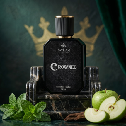 Raylam Crowned men's perfume bottle with mint and green apple on dark marble